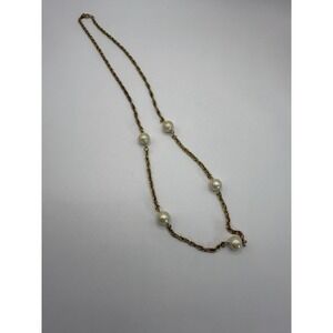 Gold tone station necklace with pearls